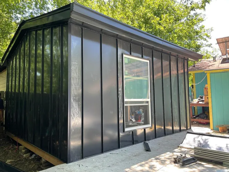 Black standing seam metal wall panels for Roof Inspection in Central Point