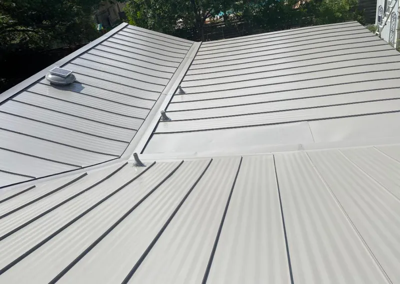 Solar attic fan installed on a metal roof for Roof Ventilation in Central Point